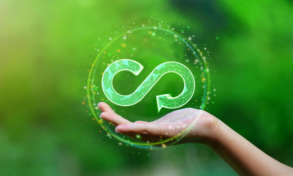 Businesswoman hold circular economy icon. The concept of eternity, endless and unlimited, circular economy for future growth of business and environment sustainable
