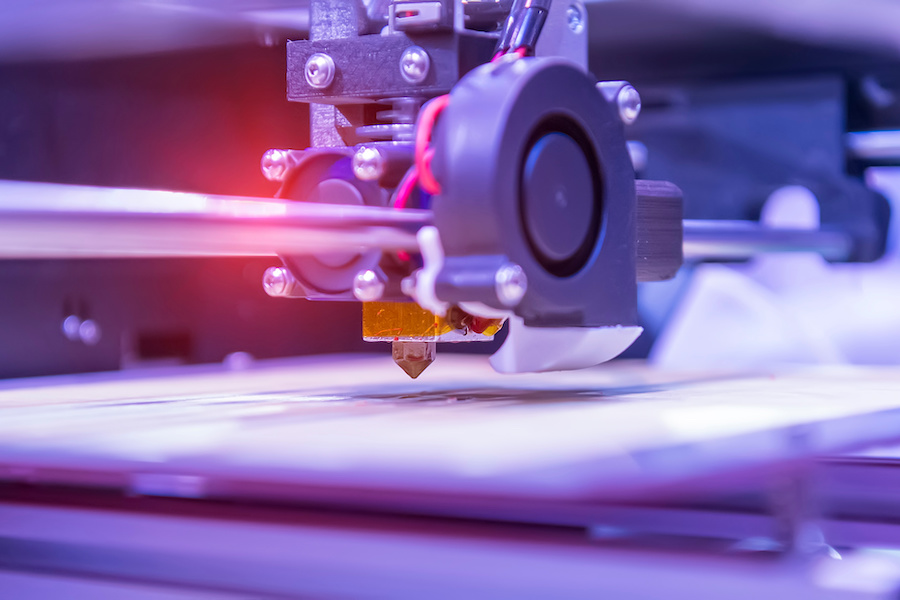 3D printer or additive manufacturing and robotic automation technology.